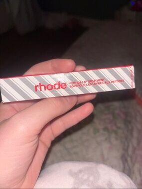 RHODE Peptide Lip Treatment in White & Red Striped Box